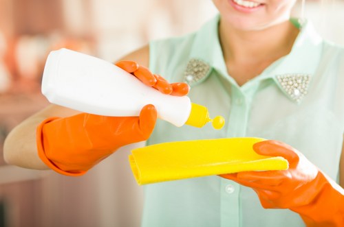 Team member following a health and safety policy during carpet cleaning